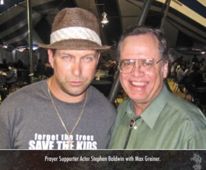 A photo of Max Greiner and Stephen Baldwin