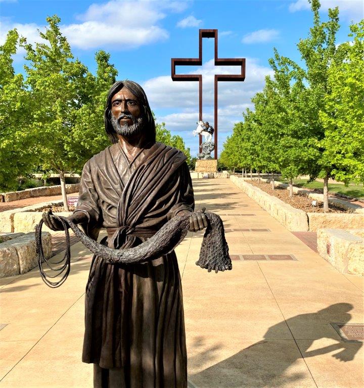 the Fisher of Men statue in front of The Empty Cross.